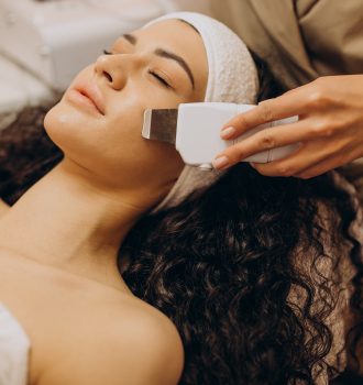 Woman at cosmetologist making beauty procedures